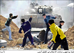 Palestinian children resisting Israeli occupation tanks with stones, in Hebron yesterday (Alayyam, 1/31/03). 