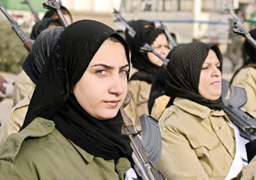 Iraqi women training to defend their country (Alquds Alarabi, 12/19/02). 