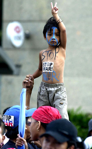 Anti-war demonstration  in Malaysia (Alquds Alarabi, 3/29/03). 